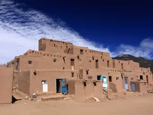 Caption: Majestic View Of Taos Pueblo Wallpaper