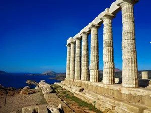 Caption: Majestic View Of The Temple Of Poseidon At Cape Sounion. Wallpaper
