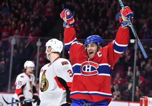 Caption: Max Pacioretty In Action Against Ottawa Senators Wallpaper