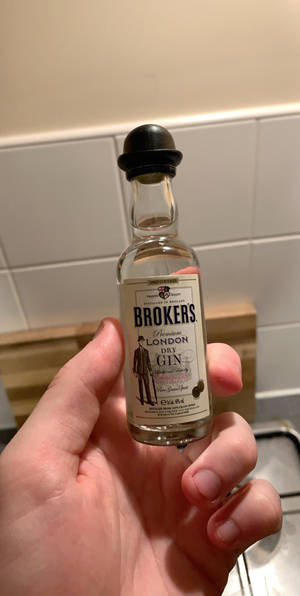 Caption: Miniature Brokers Gin Bottle Wallpaper