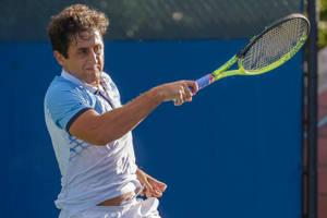 Caption: Nicolas Almagro Exhausted But Satisfied After A Rigorous Tennis Match Wallpaper