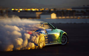 Caption: Nissan Skyline Gt-r Unleashing Power On Track Wallpaper