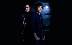 Caption: Powerful Partnership - Scott And Derek In Teen Wolf Wallpaper