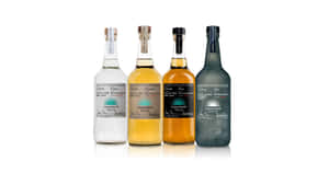 Caption: Premium Casamigos Tequila And Joven Mezcal Liquor Bottles Wallpaper