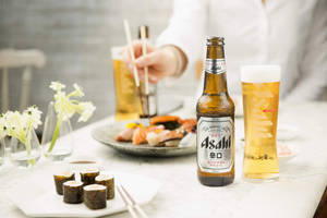 Caption: Savoring The Uniqueness Of Asahi Super Dry Beer Wallpaper