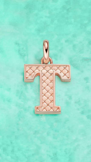 Caption: Shining Letter T Pendant Wallpaper