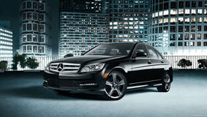 Caption: Sleek And Elegant Mercedes Benz C300 On Road Wallpaper