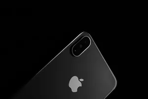 Caption: Sleek Iphone Xs With Vibrant Wallpaper Wallpaper