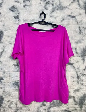 Caption: Striking Magenta Shirt On Hanger Wallpaper
