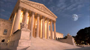 Caption: Supreme Court Building Under The Full Moon Wallpaper