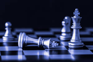 Caption: The Pensive Chess King In Defeat Wallpaper