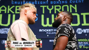 Caption: Tyron Woodley Vs. Jake Paul In Intense Boxing Match Wallpaper
