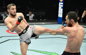 Caption: Umar Nurmagomedov In Action Wallpaper