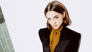 Caption: Vibrant Portrait Of Natalia Dyer With Short Hair Wallpaper