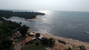 Caption: Vibrant Sunset Over Cameroon's Landscape Wallpaper