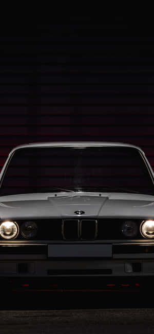Caption: Vintage Elegance - Classic Car Iphone Wallpaper Wallpaper