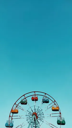 Caption: Whimsical Blue Ferris Wheel In Minimalist Style Wallpaper
