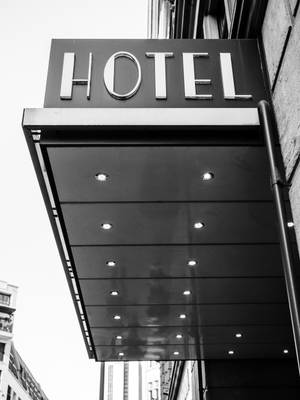 Captivating Grayscale Image Of A Classic Hotel Sign Wallpaper