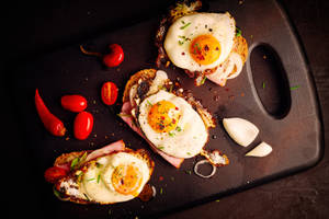 Captivating Picture Of Gourmet Steak Tartare Garnished With Egg Yolk Wallpaper