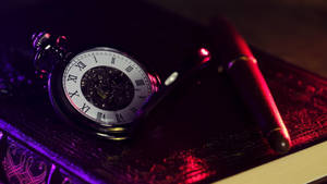 Captivating Stopwatch In Dim Light Wallpaper