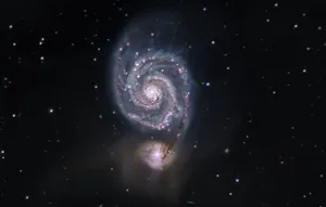 Captivating Whirlpool Galaxy In The Night Sky Wallpaper
