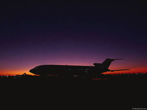 Capturing The Golden Hour In The Sky Wallpaper