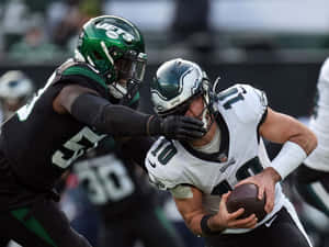 Carl Lawson Vs Miami Dolphins Wallpaper