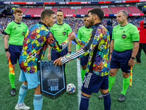 Carles Gil Handshaking With Minnesota Players Wallpaper