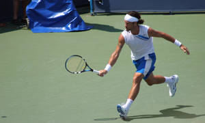 Carlos Moya Running With Racket Wallpaper