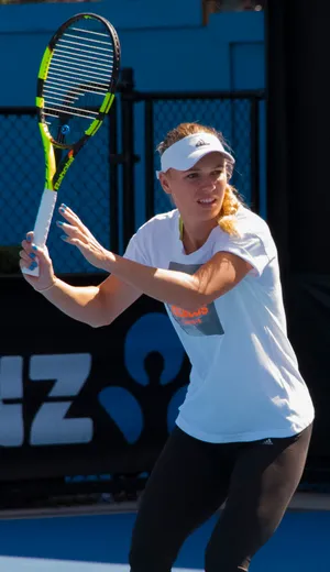 Caroline Wozniacki With Tennis Racket Wallpaper
