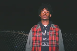Carti Pfp With Plaid Jacket Wallpaper