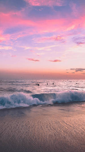 Catch A Breathtaking Pink Sunset With This Iphone Background. Wallpaper