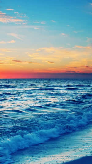 Catch The Sun's Last Rays Before The Day Comes To An End At Sunset Beach Wallpaper