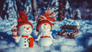 Celebrate Christmas With A Snow-filled Winter Wonderland Wallpaper