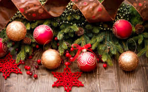 Celebrate The Festive Season With A Glittery Christmas Ornament Wallpaper