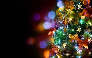 Celebrate The Holidays With This Festive Christmas Tree Display Wallpaper