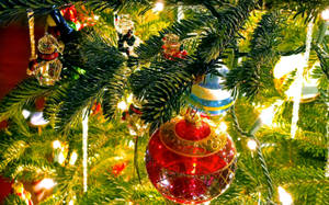 Celebrating The Holidays With Christmas Tree Decorations Wallpaper