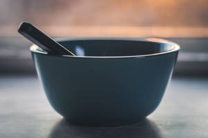 Ceramic Bowl With Spoon Wallpaper