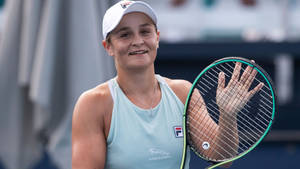 Champion Ashleigh Barty In Action Wallpaper