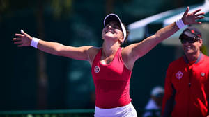 Champion Bianca Andreescu Celebrates A Stunning Victory Wallpaper