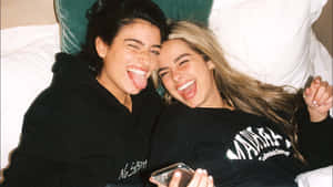 Charli And Addison Lying On The Bed Wallpaper
