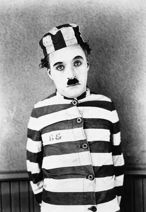 Charlie Chaplin As Prisoner Wallpaper