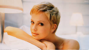 Charlize Theron Showing The Light In The Dark Wallpaper