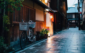 Charming Bicycle On Cobblestone Street Wallpaper