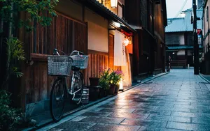 Charming Bicycle On Cobblestone Street Wallpaper