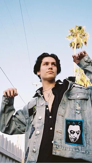 Chase Hudson Looking Cool In A Black And White Photoshoot Wallpaper