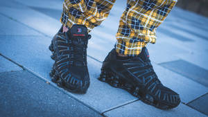 Checkered Pants And Running Shoes Wallpaper