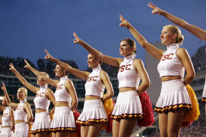 Cheerleader Pointing Upward Wallpaper