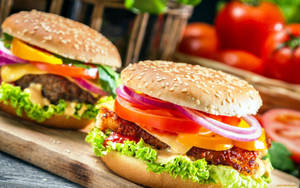 Cheeseburger With Fresh Vegetable Toppings Wallpaper