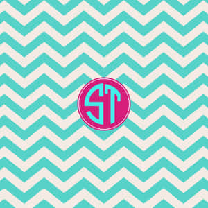 Chevron Pattern With A Monogram On It Wallpaper